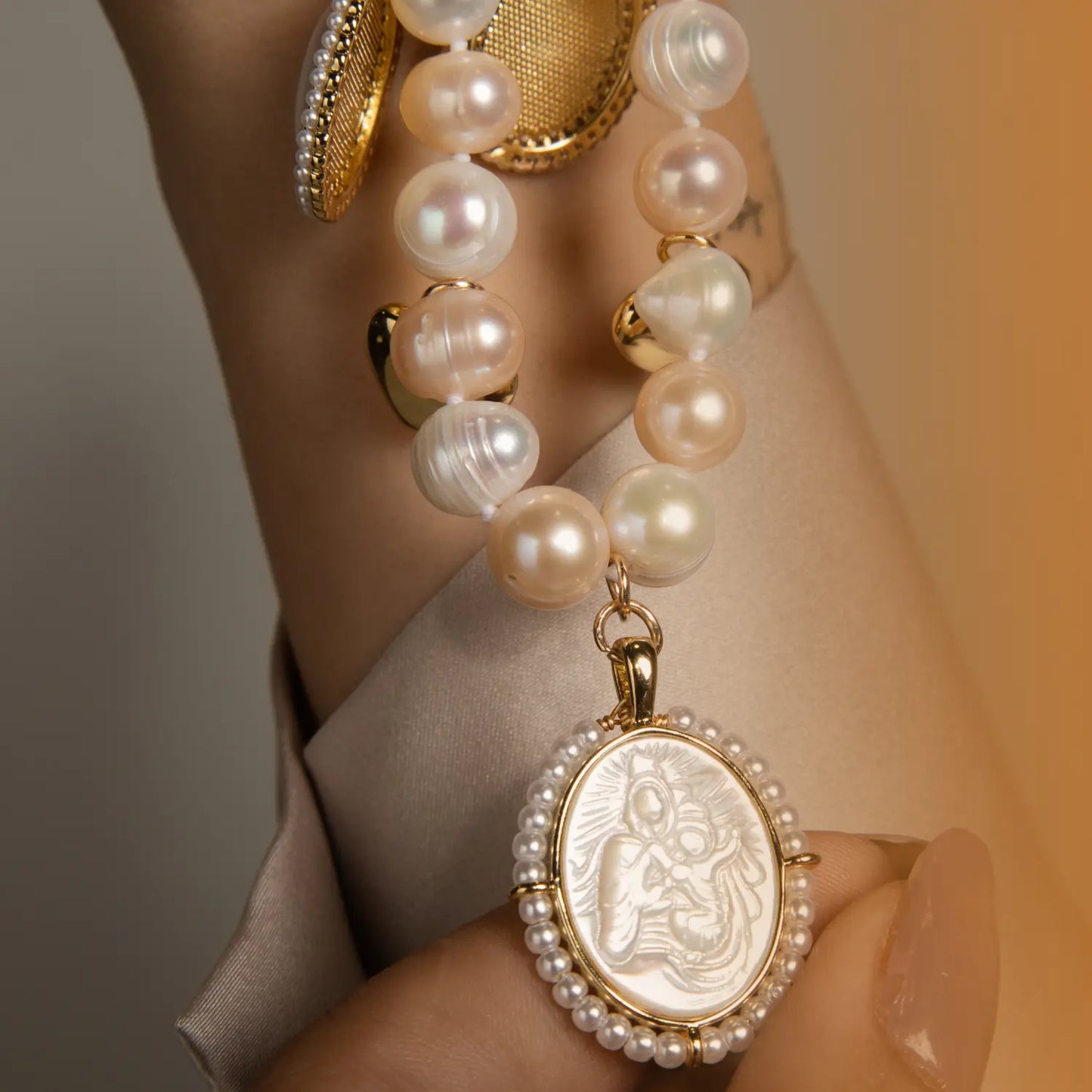 Pearl Necklace with Mother of Pearl and Virgin Charms